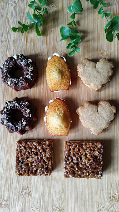 A generous pastry box with two of each handmade treat. Perfect for sharing, gifting, or indulging together.